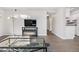 Bright living room with a modern electric fireplace and neutral color palette at 7375 E Quincy Ave # 204, Denver, CO 80237