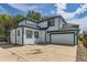 Back of a two-story home with an attached two car garage and neutral siding at 511 Noel Ave, Longmont, CO 80501