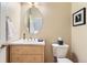 Powder room featuring a modern vanity and toilet at 511 Noel Ave, Longmont, CO 80501