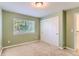 A bright bedroom boasts neutral walls, carpet flooring and a large closet with sliding doors at 511 Noel Ave, Longmont, CO 80501