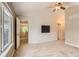 Spacious bedroom with a chandelier and wall mounted television at 511 Noel Ave, Longmont, CO 80501