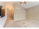 Spacious bedroom with a chandelier and large carpeted floors at 511 Noel Ave, Longmont, CO 80501