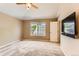 Bedroom with a vaulted ceiling, carpeted floors, and a wall mounted television at 511 Noel Ave, Longmont, CO 80501