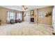 Spacious living room with neutral tones, a cozy fireplace, and ample natural light at 511 Noel Ave, Longmont, CO 80501