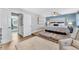 Bedroom with elevated bed, plush rugs, and a sitting area at 15592 E Kenyon Ave, Aurora, CO 80013