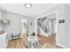 Hallway featuring a staircase with iron railings, wood floors and an open feel at 15592 E Kenyon Ave, Aurora, CO 80013