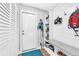 Mudroom with built-in storage and access to a closet and the exterior at 15592 E Kenyon Ave, Aurora, CO 80013