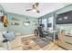 Home office featuring ample lighting, a ceiling fan, and stylish decor at 15592 E Kenyon Ave, Aurora, CO 80013