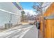 Concrete patio offers an excellent outdoor space, complemented by privacy fencing at 15592 E Kenyon Ave, Aurora, CO 80013
