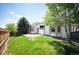 Lush backyard featuring a privacy fence, grassy lawn and a concrete patio at 15577 Greenstone Cir, Parker, CO 80134