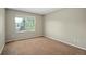 Bedroom with neutral paint and carpet, and a bright window at 15577 Greenstone Cir, Parker, CO 80134