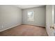 Cozy bedroom with neutral paint and carpet, and a bright window at 15577 Greenstone Cir, Parker, CO 80134