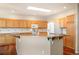 Bright kitchen with skylight, island, stainless steel appliances, and ample counter space at 15577 Greenstone Cir, Parker, CO 80134