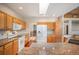 Contemporary kitchen featuring stainless steel appliances, wood cabinets and hardwood floors at 15577 Greenstone Cir, Parker, CO 80134