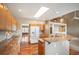 Modern kitchen featuring a skylight, stainless steel appliances, island and hardwood floors at 15577 Greenstone Cir, Parker, CO 80134