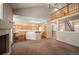 Bright and open living area with kitchen access and vaulted ceiling at 15577 Greenstone Cir, Parker, CO 80134