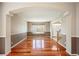 Bright, inviting living room with large window and beautiful hardwood flooring at 15577 Greenstone Cir, Parker, CO 80134