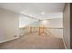 Upstairs loft area with neutral carpet and railing overlooks the main floor at 15577 Greenstone Cir, Parker, CO 80134