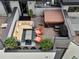 Aerial view showcases rooftop lounge area with hot tub, seating, and outdoor decor at 1880 W 32Nd Ave, Denver, CO 80211