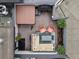 Aerial view of a rooftop deck with a hot tub, lounge area, grill, and string lights at 1880 W 32Nd Ave, Denver, CO 80211