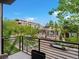 Balcony overlooking a street with leafy trees and neighborhood buildings at 1880 W 32Nd Ave, Denver, CO 80211
