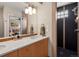 Bathroom with a spacious countertop, sleek fixtures, and a modern tiled shower at 1880 W 32Nd Ave, Denver, CO 80211