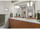 Bathroom with double sinks, modern lighting, and a large mirror reflecting the space at 1880 W 32Nd Ave, Denver, CO 80211