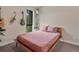Charming bedroom with musical instruments as decor and a large window with natural light at 1880 W 32Nd Ave, Denver, CO 80211