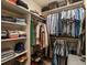Well-organized walk-in closet filled with neatly arranged clothing and accessories at 1880 W 32Nd Ave, Denver, CO 80211
