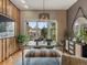 Bright dining room with stylish decor, light wood floors, modern lighting, and access to a balcony at 1880 W 32Nd Ave, Denver, CO 80211