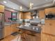 Modern kitchen featuring stainless steel appliances, an island with bar stools, and sleek countertops at 1880 W 32Nd Ave, Denver, CO 80211