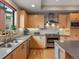 Well-lit kitchen showcasing updated appliances, stylish backsplash, and ample counter space at 1880 W 32Nd Ave, Denver, CO 80211