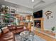 Inviting living space with a fireplace, modern finishes, and an open layout to the kitchen at 1880 W 32Nd Ave, Denver, CO 80211