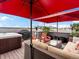 Entertaining rooftop deck with a hot tub, grill, city view, and comfortable lounge seating at 1880 W 32Nd Ave, Denver, CO 80211