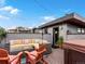 Relaxing rooftop patio featuring a comfortable outdoor seating area and hot tub at 1880 W 32Nd Ave, Denver, CO 80211
