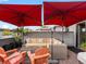 Outdoor patio with comfortable seating and shade under bright umbrellas at 1880 W 32Nd Ave, Denver, CO 80211