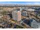 Aerial view of high-rise apartment building in an urban area with city skyline at 3131 E Alameda Ave # 2102, Denver, CO 80209