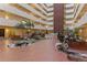 A view of the atrium featuring plants, benches and an elaborate walkway at 3131 E Alameda Ave # 2102, Denver, CO 80209