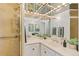 Beautiful bathroom with a glass-enclosed shower and vanity with great lighting at 3131 E Alameda Ave # 2102, Denver, CO 80209