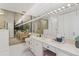 Bright bathroom featuring a large mirror, ample counter space, and modern fixtures at 3131 E Alameda Ave # 2102, Denver, CO 80209