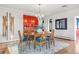 Bright dining room with hardwood floors, a chandelier, and an open connection to other living spaces at 3131 E Alameda Ave # 2102, Denver, CO 80209