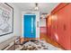 Stylish entryway with a bright blue door, closet and unique decorative elements at 3131 E Alameda Ave # 2102, Denver, CO 80209