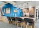 Modern kitchen featuring granite countertops, stainless steel appliances, and stylish bar seating at 3131 E Alameda Ave # 2102, Denver, CO 80209