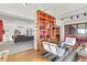 Open-concept living room featuring modern decor, a built-in bookcase, and a stylish sitting area at 3131 E Alameda Ave # 2102, Denver, CO 80209