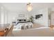 Primary bedroom featuring soft carpet, ample natural light, contemporary chandelier, and seating at 3131 E Alameda Ave # 2102, Denver, CO 80209