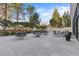 Outdoor patio featuring lounge chairs, dining sets and mature trees at 3131 E Alameda Ave # 2102, Denver, CO 80209