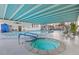 Indoor pool and hot tub with blue accents and plenty of seating at 3131 E Alameda Ave # 2102, Denver, CO 80209