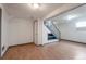 Finished basement with laminate flooring, stairs and neutral paint at 12931 W 20Th Ave, Golden, CO 80401