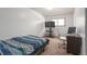 Bright bedroom with a cozy bed, desk, and plenty of natural light at 12931 W 20Th Ave, Golden, CO 80401