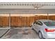 Assigned carport parking featuring a car with a wood privacy fence and gated access at 12931 W 20Th Ave, Golden, CO 80401